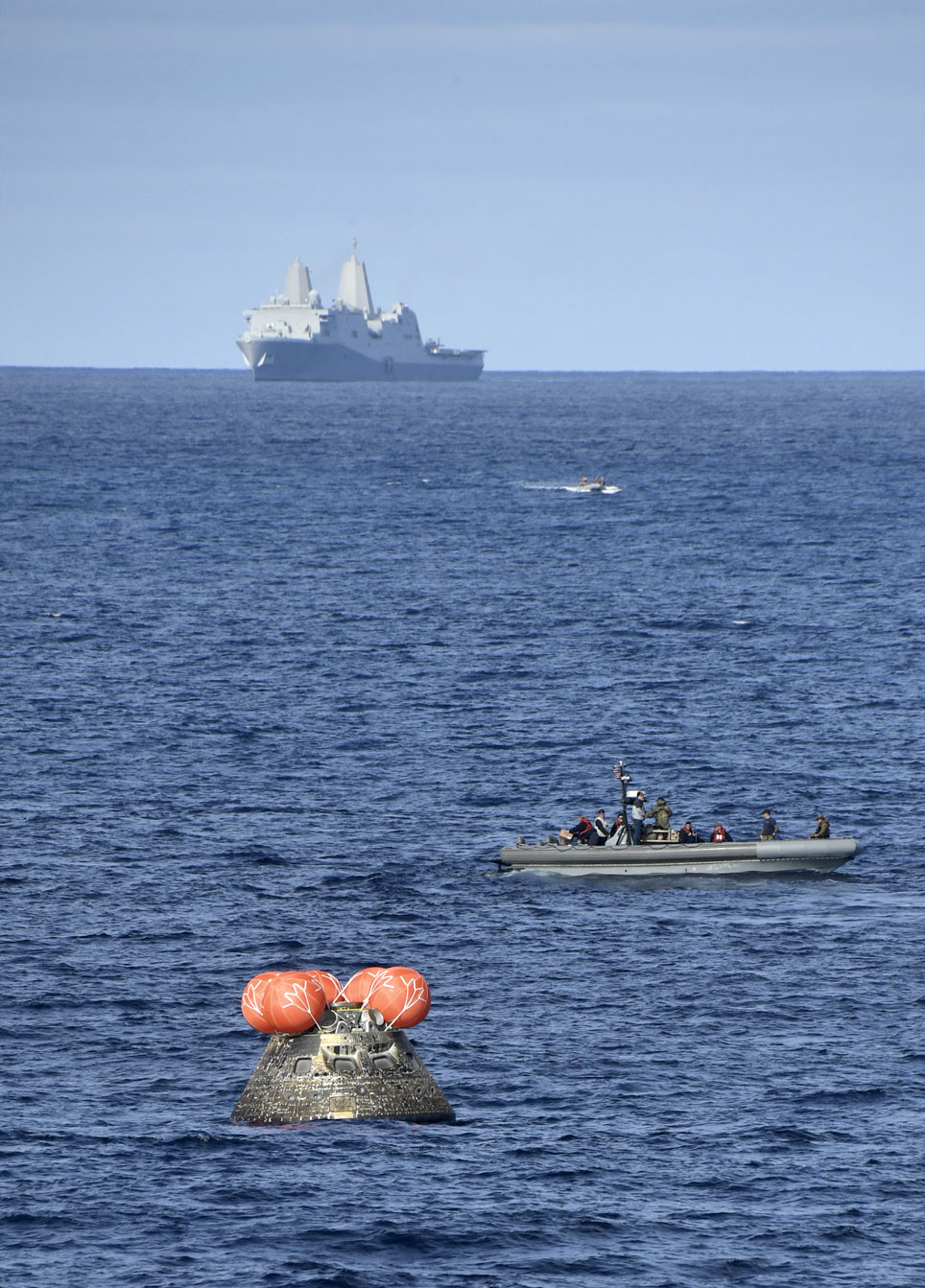 The Orion spacecraft awaiting retrieval by the USS Portland in the Pacific Ocean