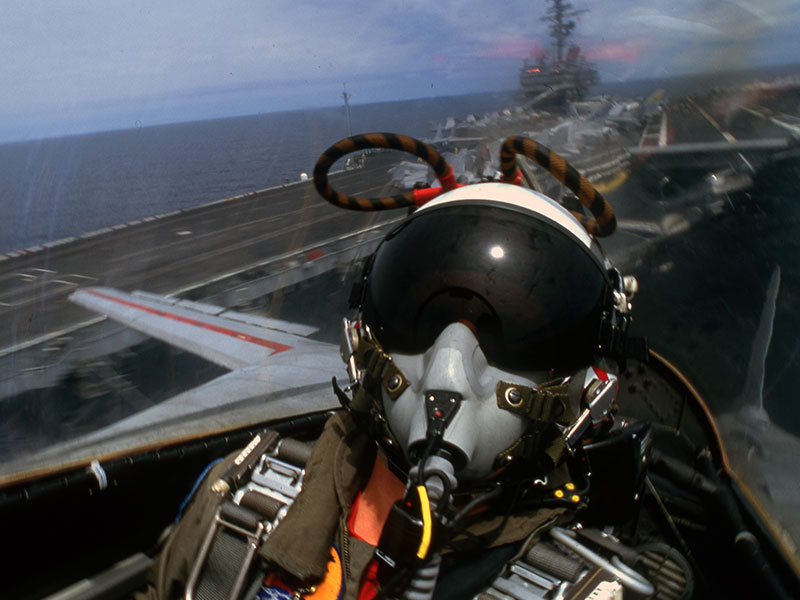 Navy pilot in F-14 above carrier deck