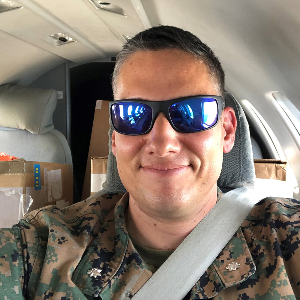 white male soldier wearing sunglasses