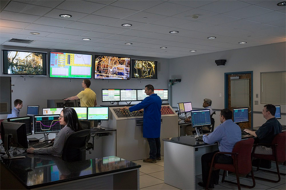 Workers in a control room.