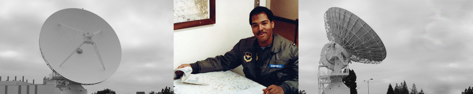 male in Air Force uniform next a satellite