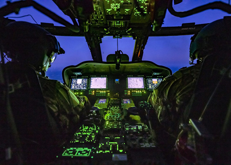 military helicopter cockpit with pilots