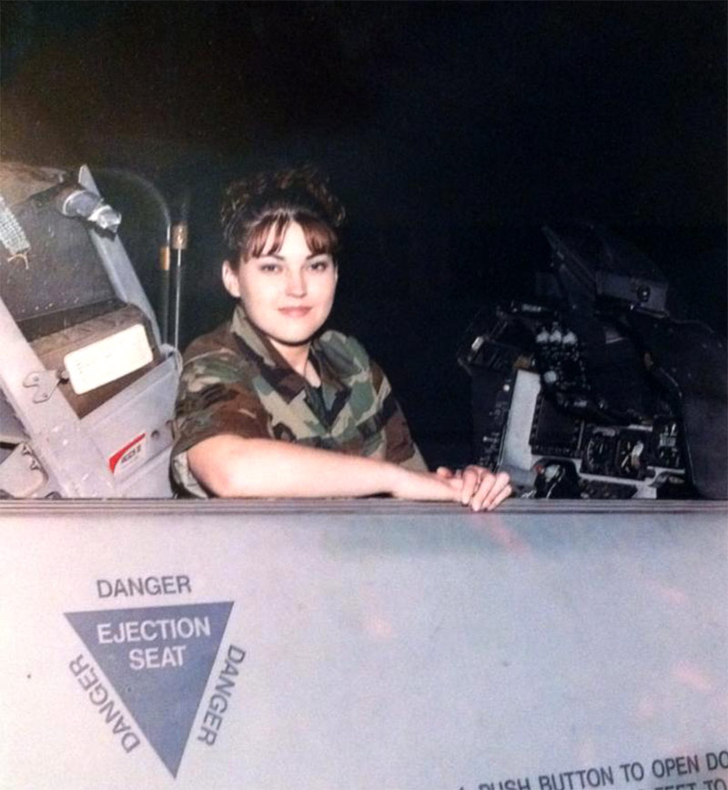 female soldier in cockpit